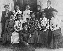 A black and white image of Alaska Native girls at a boarding school run by European colonizers