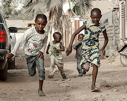 Kids running in the street in Mali