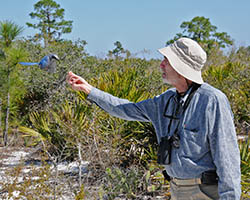 Paul Ehrlich with blue jay