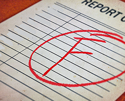 A report card showing an "F" grade