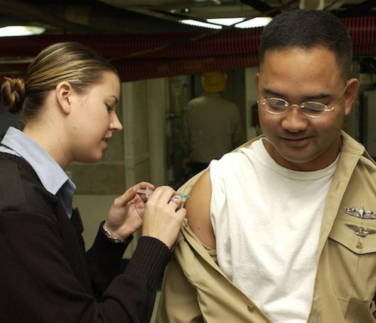 Vaccine being given to a Navy recruit