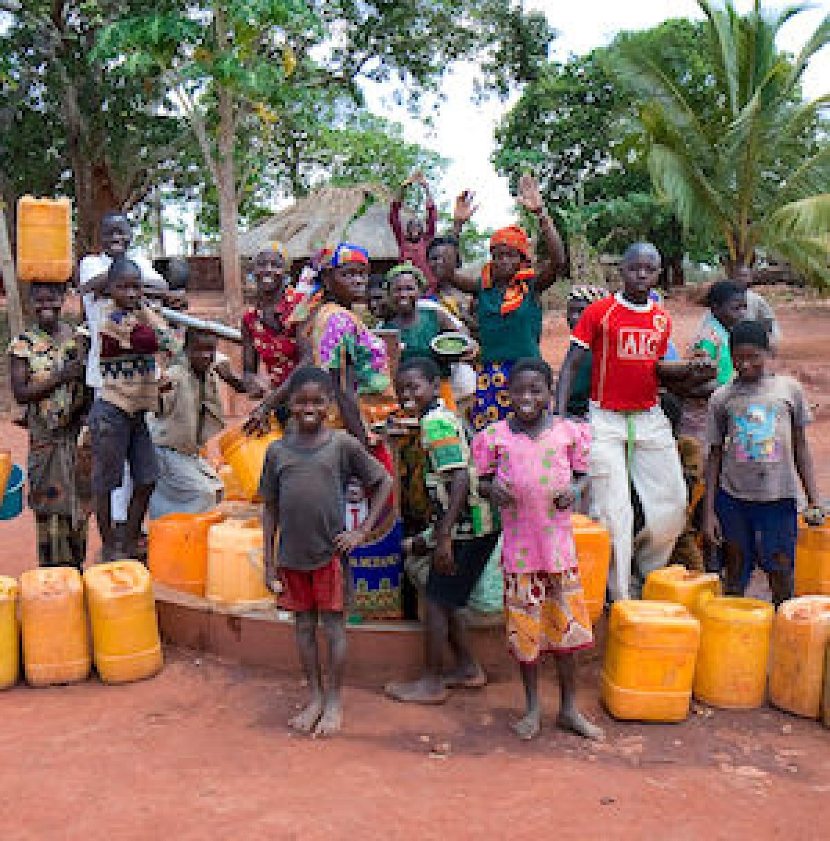 People around a well in Nivale, Mozambique